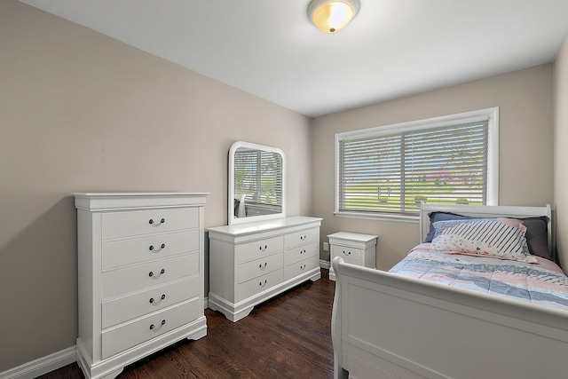 1090 S Williams Lake Rd, White Lake, MI 48386 - bedroom featuring dark wood-type flooring and baseboards