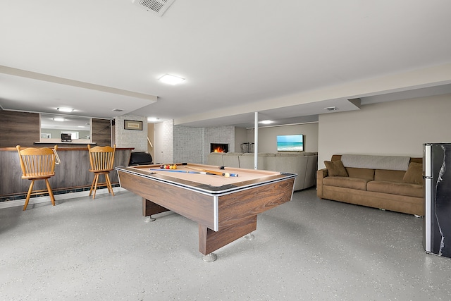 1090 S Williams Lake Rd, White Lake, MI 48386 - rec room with bar area, pool table, a fireplace, and speckled floor