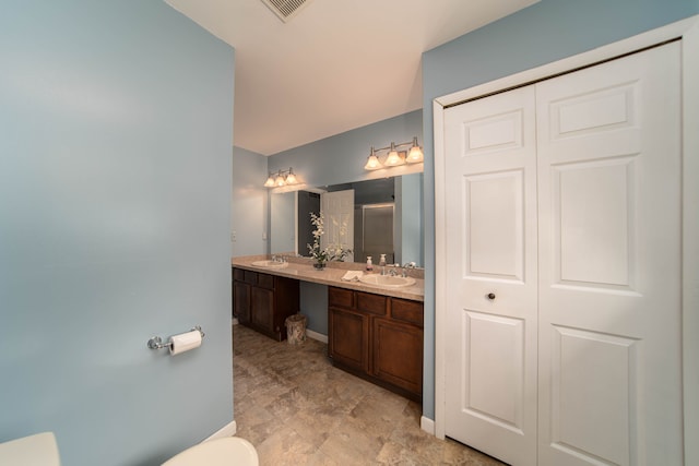 3142 Buss Dr, Commerce Twp, MI 48390 - full bath with toilet, double vanity, baseboards, and a shower with door