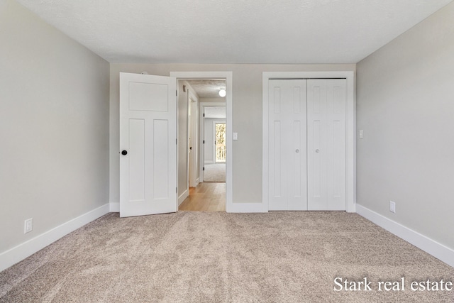 3339 N Weber Rd, Muskegon, MI 49445 - unfurnished bedroom featuring carpet flooring, baseboards, and a closet