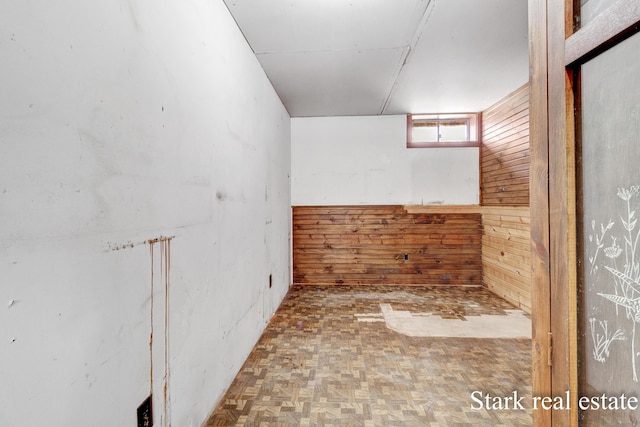3339 N Weber Rd, Muskegon, MI 49445 - spare room with wood walls