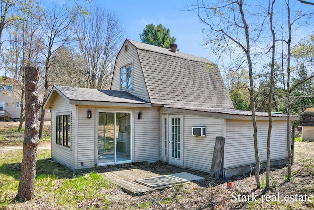 3339 N Weber Rd, Muskegon, MI 49445 - rear view of house with a gambrel roof and a shingled roof