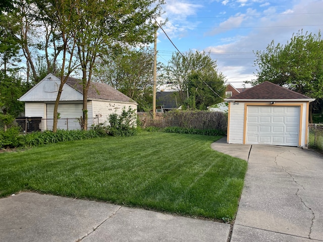 11520 Engleside St, Detroit, MI 48205 - view of yard featuring an outbuilding, a garage, and concrete driveway