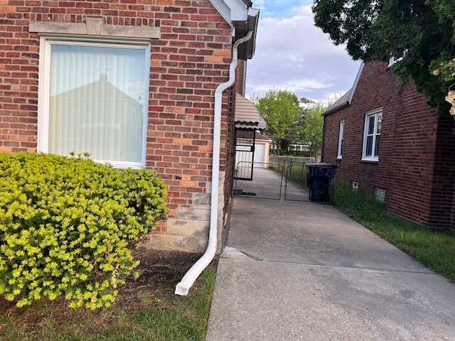 11520 Engleside St, Detroit, MI 48205 - view of side of property featuring a gate and brick siding