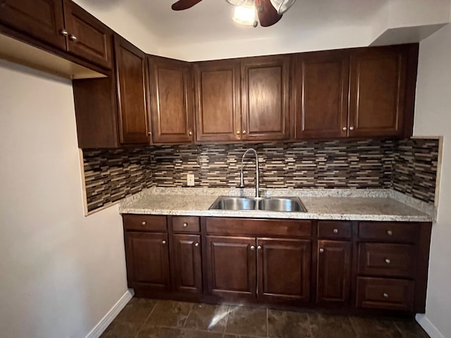 11520 Engleside St, Detroit, MI 48205 - kitchen featuring a sink, baseboards, a ceiling fan, and decorative backsplash