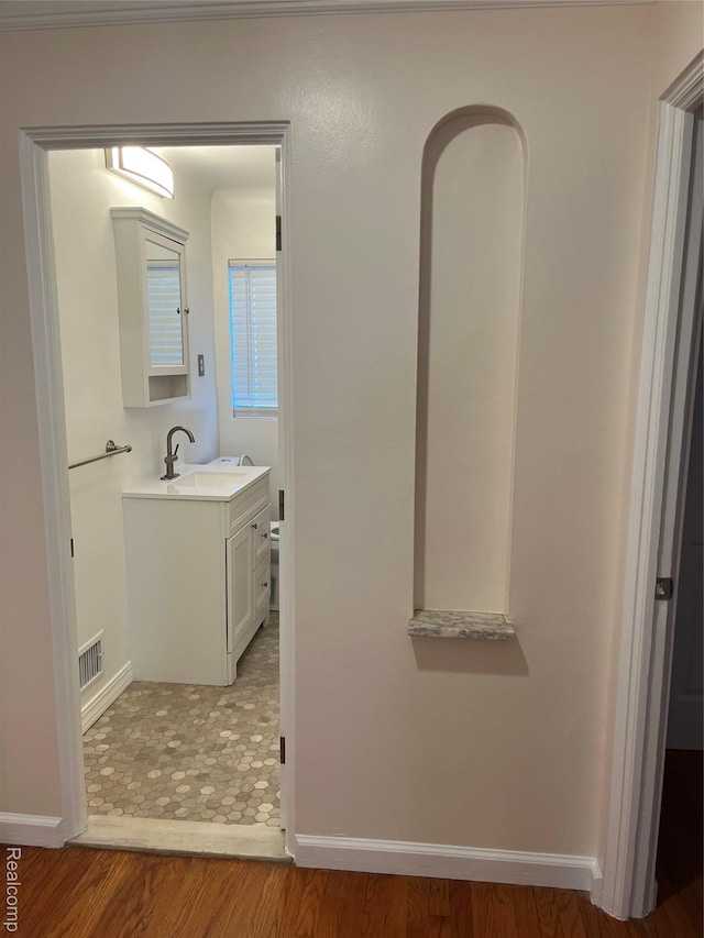 11520 Engleside St, Detroit, MI 48205 - bathroom featuring vanity, baseboards, and wood finished floors