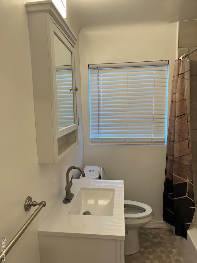 11520 Engleside St, Detroit, MI 48205 - full bathroom with toilet, vanity, and tile patterned flooring