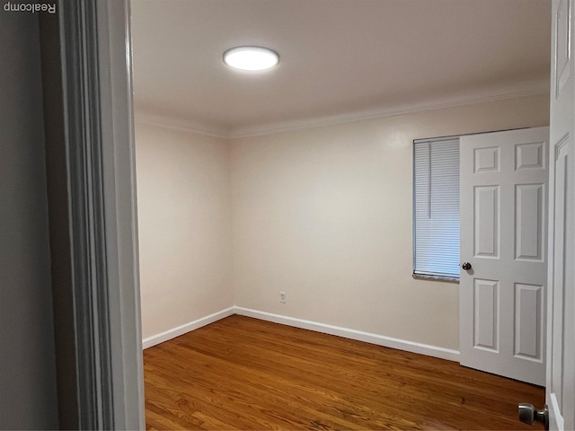 11520 Engleside St, Detroit, MI 48205 - empty room featuring crown molding, wood finished floors, and baseboards