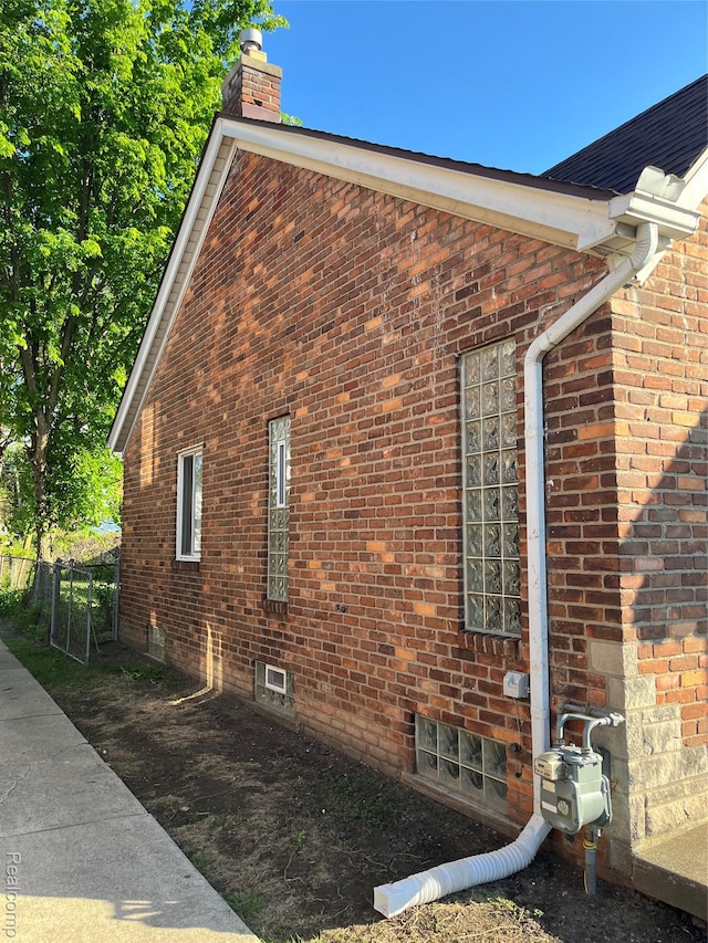 11520 Engleside St, Detroit, MI 48205 - view of property exterior with a chimney and brick siding