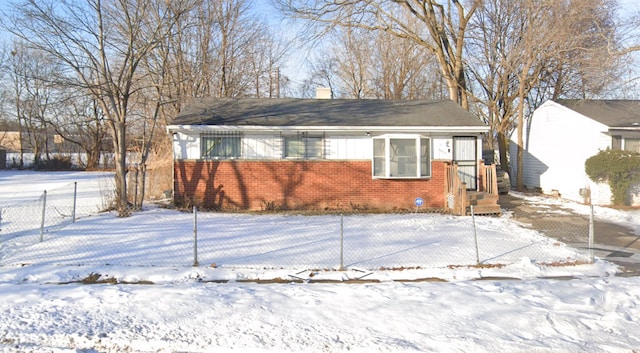 1622 Barbara Dr, Flint, MI 48504 - view of front facade with brick siding and fence