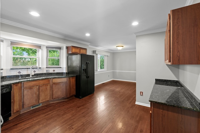 50631 Newcastle Dr, Chesterfield, MI 48047 - kitchen featuring black appliances, a sink, dark stone countertops, brown cabinets, and dark wood-style floors