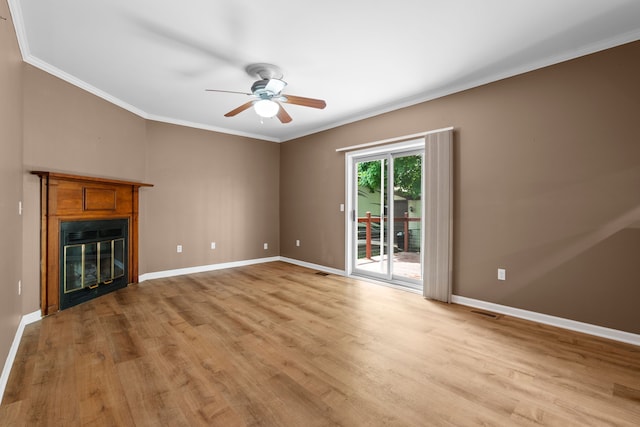 50631 Newcastle Dr, Chesterfield, MI 48047 - unfurnished living room featuring ceiling fan, light wood-style flooring, baseboards, ornamental molding, and a glass covered fireplace