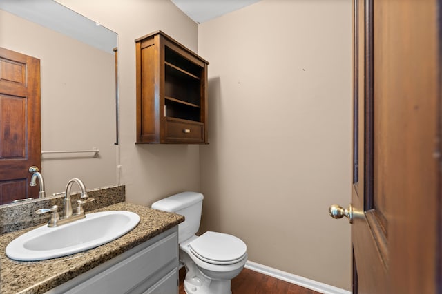 50631 Newcastle Dr, Chesterfield, MI 48047 - bathroom featuring toilet, wood finished floors, and vanity