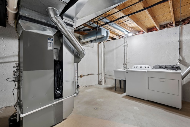50631 Newcastle Dr, Chesterfield, MI 48047 - unfinished below grade area featuring washing machine and clothes dryer