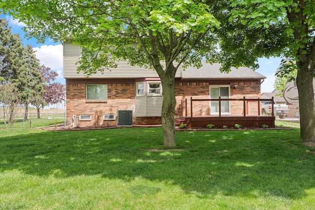 50631 Newcastle Dr, Chesterfield, MI 48047 - rear view of property featuring brick siding, cooling unit, and a deck