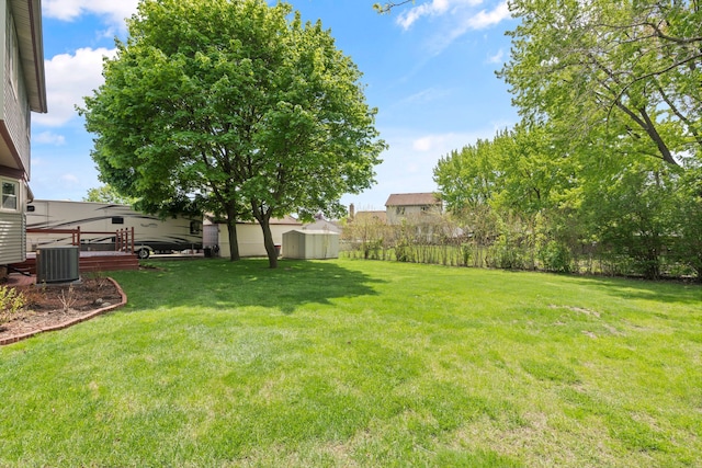 50631 Newcastle Dr, Chesterfield, MI 48047 - view of yard featuring central AC unit and a wooden deck
