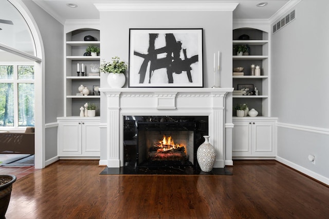 1303 Towsley Ln, Ann Arbor, MI 48105 - living area with built in shelves, crown molding, a premium fireplace, dark wood-style floors, and baseboards