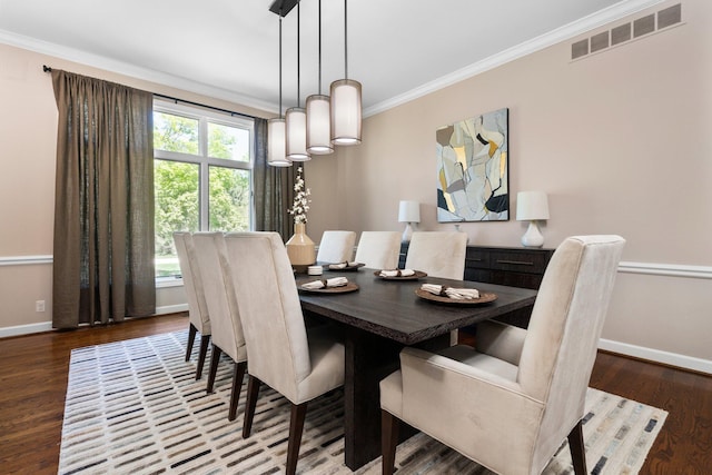 1303 Towsley Ln, Ann Arbor, MI 48105 - dining space with baseboards, ornamental molding, and wood finished floors