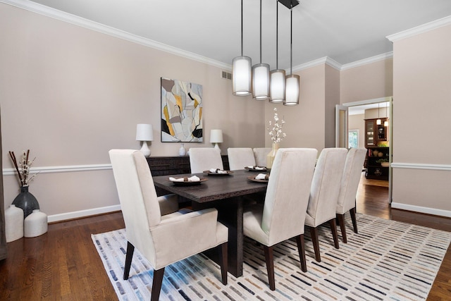 1303 Towsley Ln, Ann Arbor, MI 48105 - dining space featuring wood finished floors, baseboards, and ornamental molding