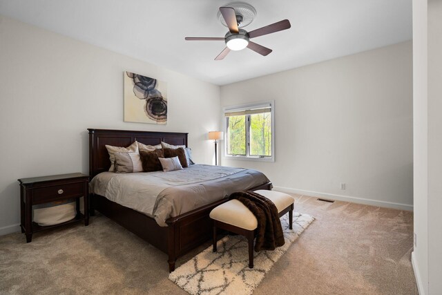 1303 Towsley Ln, Ann Arbor, MI 48105 - carpeted bedroom featuring baseboards and ceiling fan
