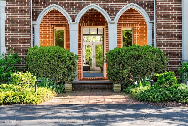 1303 Towsley Ln, Ann Arbor, MI 48105 - doorway to property with brick siding and french doors