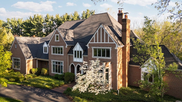 1303 Towsley Ln, Ann Arbor, MI 48105 - english style home featuring brick siding and a chimney