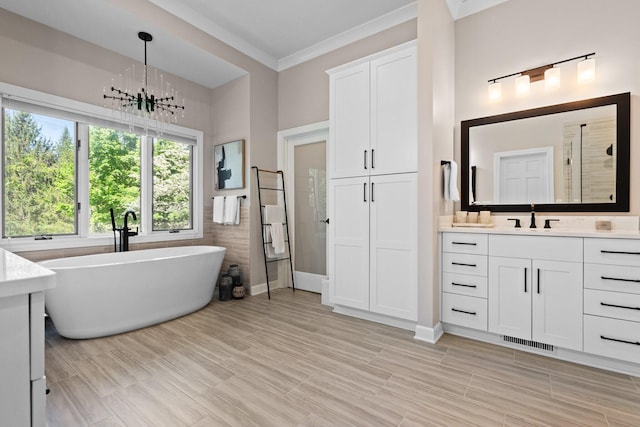 1303 Towsley Ln, Ann Arbor, MI 48105 - bathroom with a soaking tub, vanity, tiled shower, and crown molding