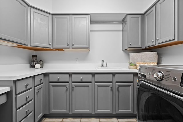 1303 Towsley Ln, Ann Arbor, MI 48105 - clothes washing area featuring washer / clothes dryer and cabinet space