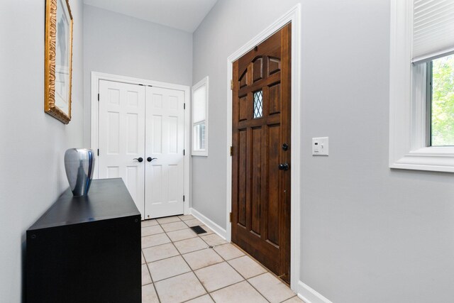 1303 Towsley Ln, Ann Arbor, MI 48105 - foyer entrance with light tile patterned flooring and baseboards