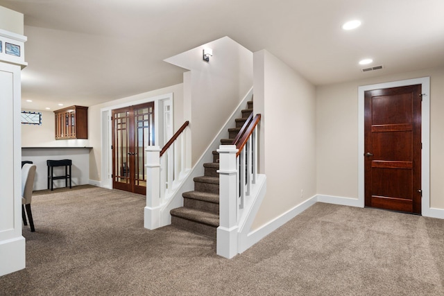 1303 Towsley Ln, Ann Arbor, MI 48105 - carpeted entrance foyer with french doors, stairway, baseboards, and recessed lighting