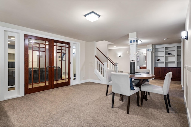 1303 Towsley Ln, Ann Arbor, MI 48105 - dining area featuring carpet floors, stairs, french doors, and recessed lighting