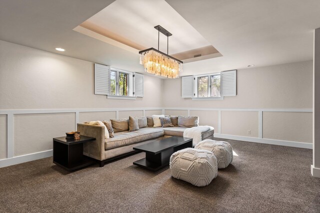 1303 Towsley Ln, Ann Arbor, MI 48105 - carpeted living room featuring a chandelier, a raised ceiling, recessed lighting, and baseboards