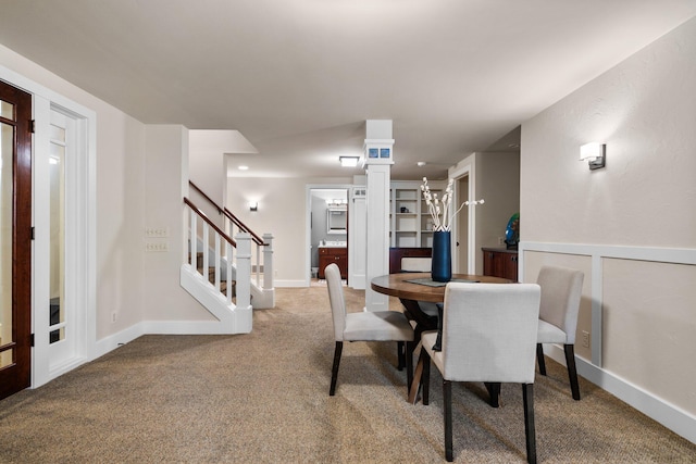 1303 Towsley Ln, Ann Arbor, MI 48105 - carpeted dining space with stairs and baseboards