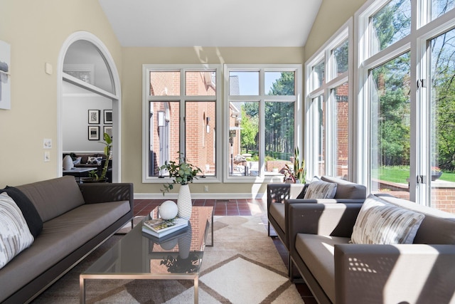 1303 Towsley Ln, Ann Arbor, MI 48105 - sunroom / solarium featuring vaulted ceiling and tile patterned floors