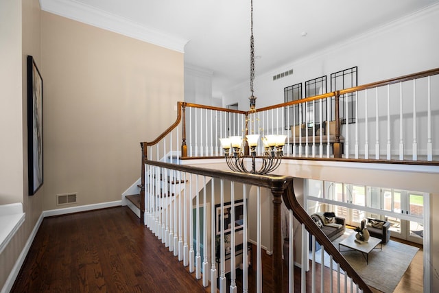 1303 Towsley Ln, Ann Arbor, MI 48105 - stairway with a chandelier, ornamental molding, wood finished floors, and baseboards
