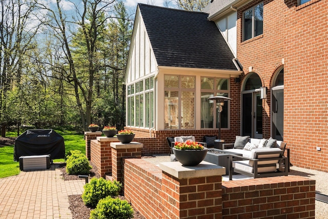 1303 Towsley Ln, Ann Arbor, MI 48105 - view of patio featuring an outdoor living space, a sunroom, and grilling area
