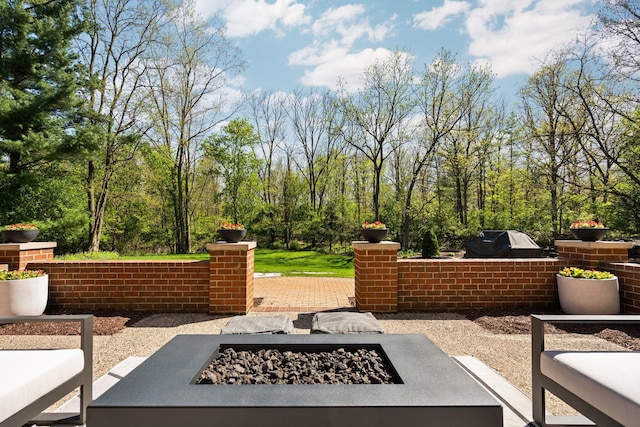 1303 Towsley Ln, Ann Arbor, MI 48105 - view of patio / terrace with an outdoor fire pit