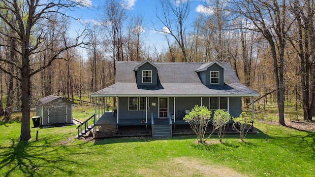 view of front of house with a porch, a shed, an outbuilding, and a front yard