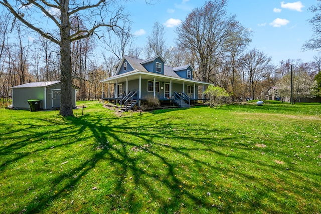 view of side of home featuring a porch, a shed, an outdoor structure, and a lawn