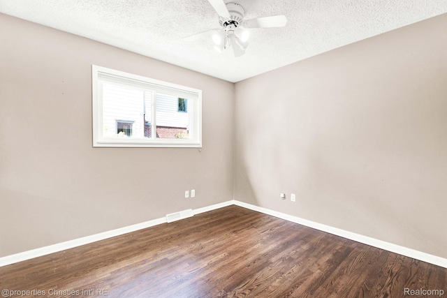 1700 Maddy Ln, Keego Harbor, MI 48320 - empty room with dark wood-type flooring, ceiling fan, and a textured ceiling