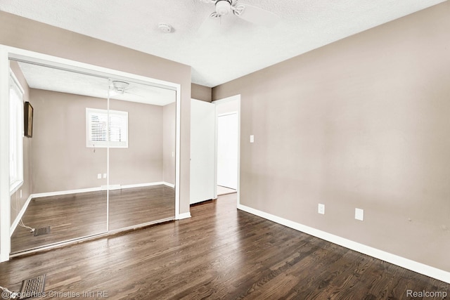 1700 Maddy Ln, Keego Harbor, MI 48320 - unfurnished bedroom featuring wood finished floors, a closet, and a ceiling fan