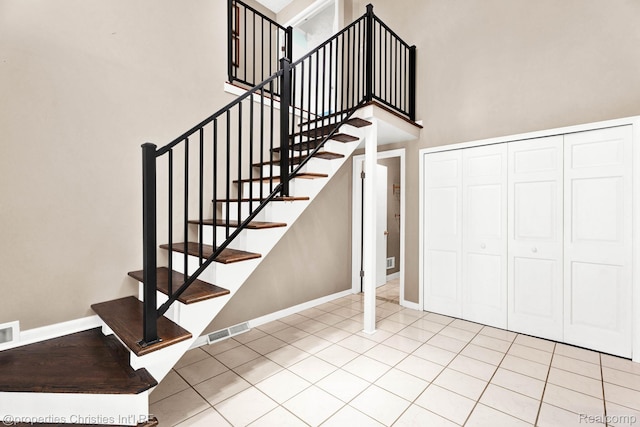 1700 Maddy Ln, Keego Harbor, MI 48320 - stairs with baseboards and a towering ceiling