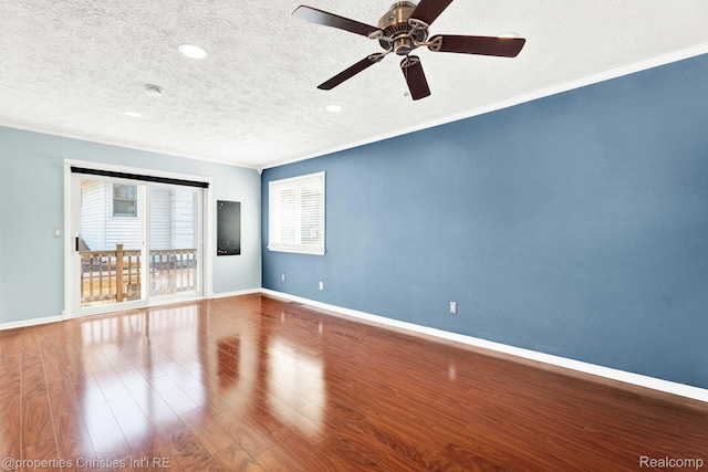 1700 Maddy Ln, Keego Harbor, MI 48320 - spare room with a textured ceiling, ceiling fan, ornamental molding, wood finished floors, and recessed lighting