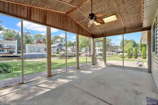 1700 Maddy Ln, Keego Harbor, MI 48320 - unfurnished sunroom featuring a residential view, a ceiling fan, vaulted ceiling, and healthy amount of natural light