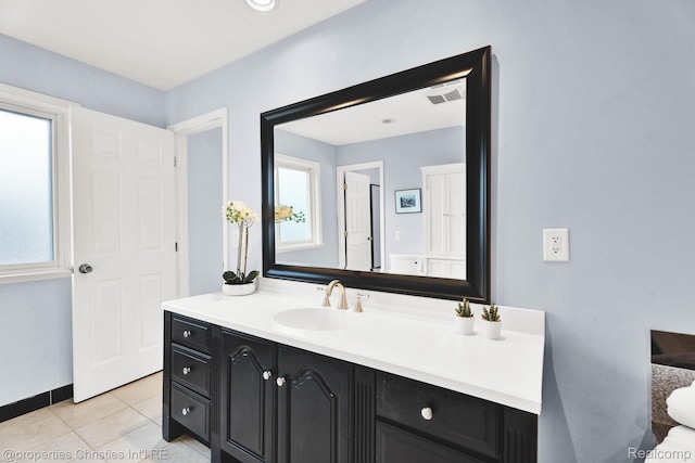 1700 Maddy Ln, Keego Harbor, MI 48320 - bathroom featuring vanity and tile patterned floors