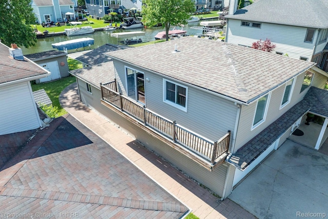 1700 Maddy Ln, Keego Harbor, MI 48320 - aerial perspective of suburban area featuring a large body of water