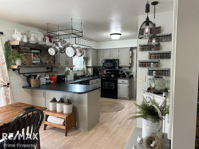 1321 Rollins St, Grand Blanc, MI 48439 - kitchen with black appliances, dark countertops, a sink, and gray cabinets