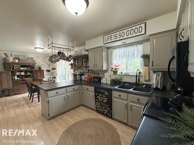 1321 Rollins St, Grand Blanc, MI 48439 - kitchen featuring gray cabinetry, a sink, black appliances, a peninsula, and dark countertops