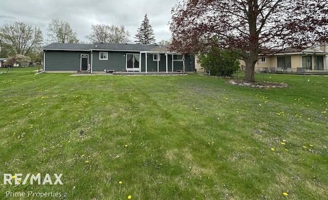 1321 Rollins St, Grand Blanc, MI 48439 - back of property with a patio area