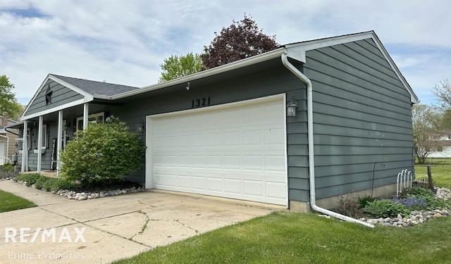 1321 Rollins St, Grand Blanc, MI 48439 - view of side of property featuring an attached garage and concrete driveway